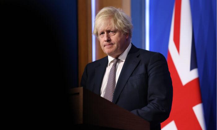 UK’s Johnson Rejects Calls for Tougher COVID-19 Travel Restrictions