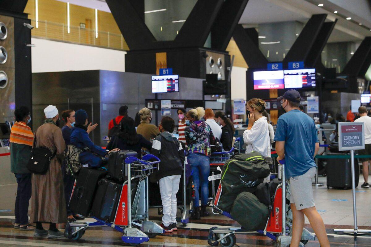 Travelers are seen at the OR Tambo International Airport in Johannesburg, South Africa, on Nov. 27, 2021. (Phill Magakoe/AFP via Getty Images)