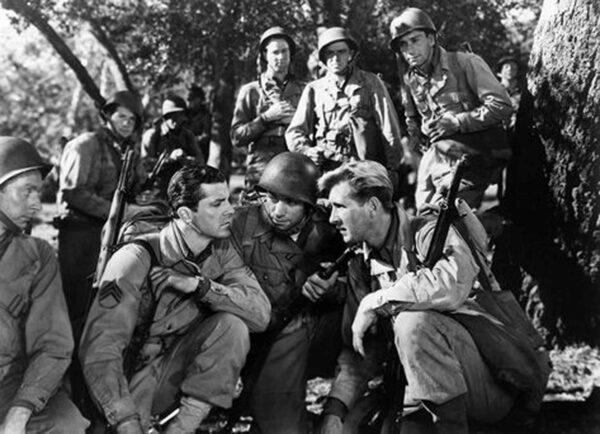 The platoon discusses strategy, in “A Walk in the Sun.” (20th Century Fox)