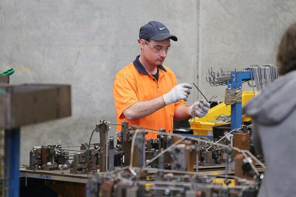An employee works at the Multi Slide Industries manufacturing plant that creates components for the motor industry in Adelaide, Australia, on Aug. 12, 2013. (Morne de Klerk/Getty Images)