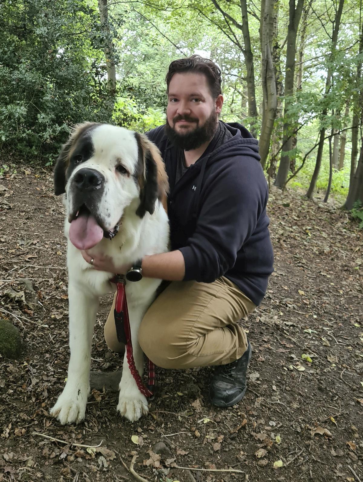 Samson the dog with owner Kyle Barrett. (SWNS)