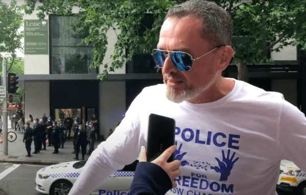 Former NSW police officer Roland Chrystal was interviewed by an Epoch Times reporter at the Freedom Rally in Sydney, Australia, on Nov. 27, 2021. (Epoch Times Sydney Staff)