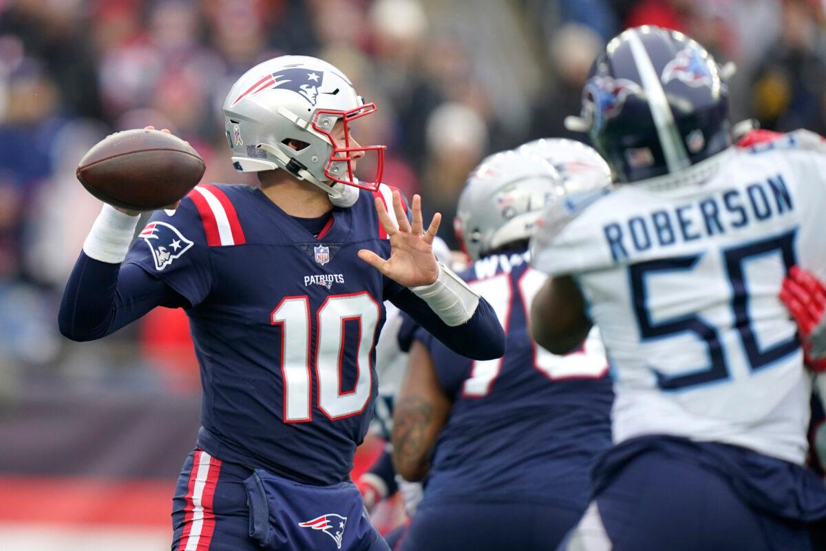 New England Patriots quarterback Mac Jones (10) passes under pressure during the first half of an NFL football game against the Tennessee Titans, in Foxborough, Mass., on Nov. 28, 2021. (Steven Senne/AP Photo)