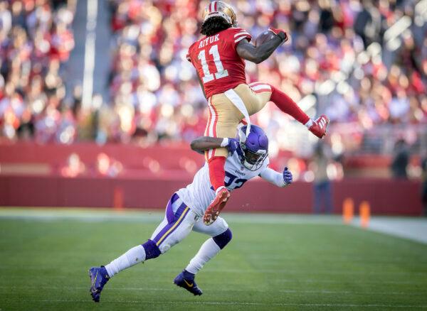 Vikings free safety Xavier Woods (23) stopped 49ers wide receiver Brandon Aiyuk (11) as he tried to hurdle him in the second quarter, in Santa Clara, CA., on November 28, 2021. (Elizabeth Flores/AP Photo)