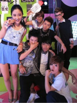 Adam Molon in 2010 with cast members of “Happy Night” on the “Happy Night” set at Jiangsu TV. Adam’s on-set name placard, showing his Chinese name “Ink Dragon” and that he is a 23-year-old American, is visible in the upper left corner. (Courtesy of Adam Molon)