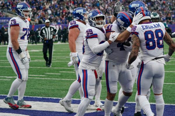 New York Giants' Chris Myarick (41), second from right, celebrates his touchdown during the second half of an NFL football game against the Philadelphia Eagles, in East Rutherford, N.J., on Nov. 28, 2021. (Corey Sipkin/AP Photo)