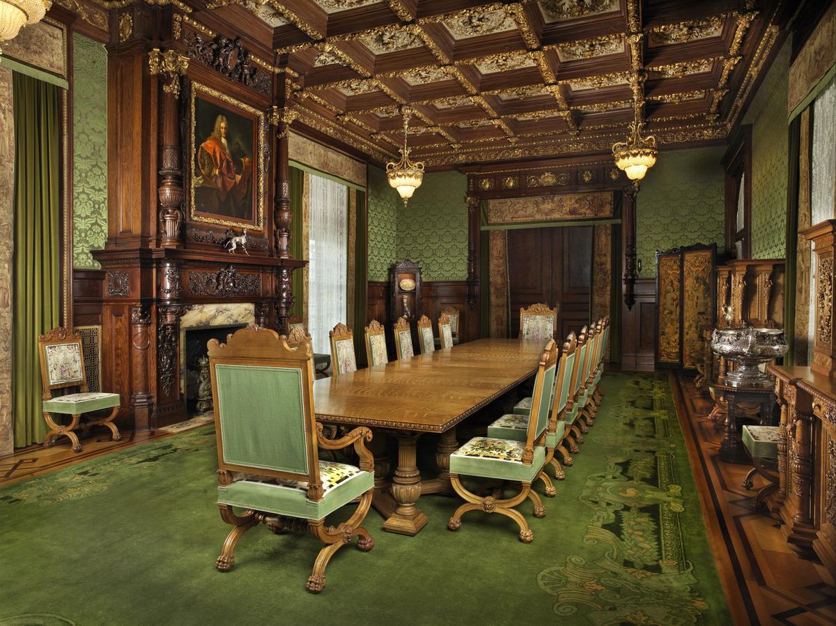 The Flaglers would host large dinner parties that would often include prominent men from financial, literary, and legal circles. The Dining Room was designed in the French Renaissance style. The ceiling is cast plaster painted to look like wood. The fireplace mantle incorporates elaborately carved culinary touches such as shells, crabs, and fruit. (Flagler Museum)