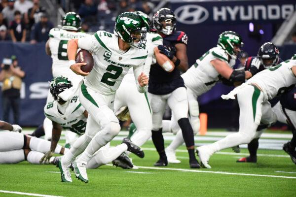New York Jets quarterback Zach Wilson (2) carries for a touchdown in the second half of an NFL football game against the Houston Texans in Houston, on Nov. 28, 2021. (Justin Rex/AP Photo))