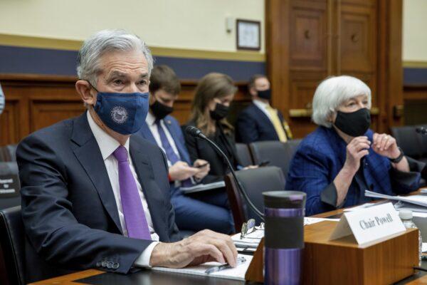 Federal Reserve Chairman Jerome Powell and Treasury Secretary Janet Yellen listen to lawmakers on Capitol Hill in D.C., on Dec. 1, 2021. (Amanda Andrade-Rhoades/AP Photo)