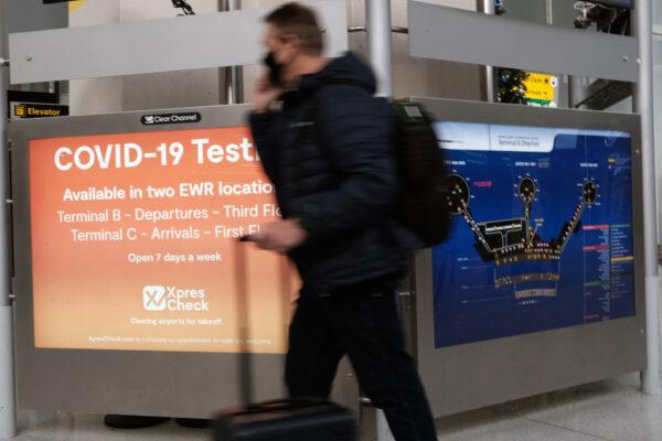A COVID-19 testing facility is advertised at Newark Liberty International Airport in New Jersey on Nov. 30, 2021. (Spencer Platt/Getty Images)
