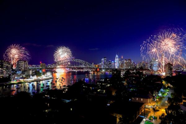Fireworks light up the sky over the Sydney Harbour Bridge during New Year's Eve celebrations in Sydney, Australia, on Dec. 31, 2021. (Mark Evans/Getty Images)