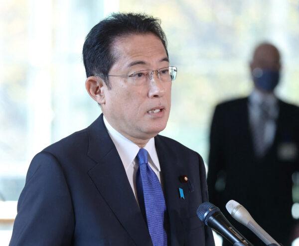 Japan's Prime Minister Fumio Kishida answers questions from reporters regarding the response to the Omicron Covid variant at his office in Tokyo on Nov. 29, 2021. (JIJI Press/AFP via Getty Images)