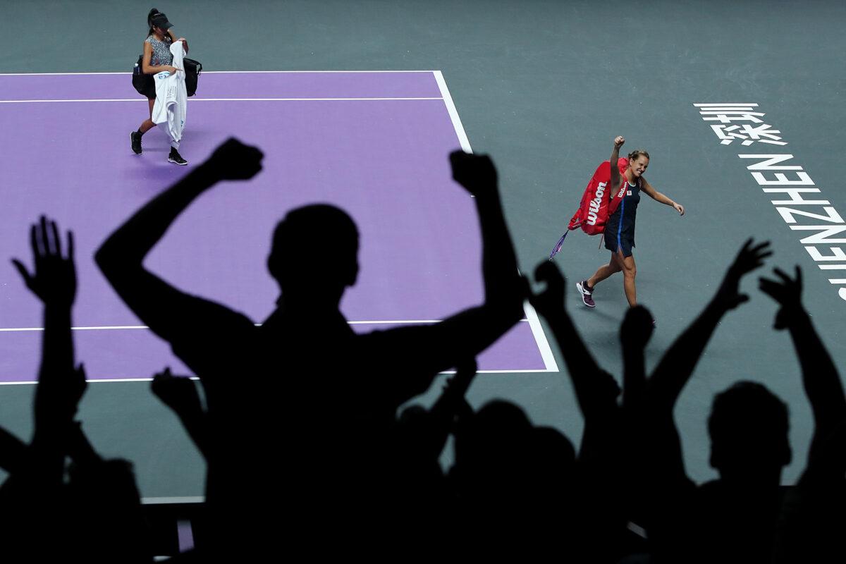 Barbora Strycova (R) of the Czech Republic and Su-Wei Hsieh of Chinese Taipei react to the crowd as they walk off the court after their Women's Doubles semifinal match victory over Anna-Lena Groenefeld of Germany and Demi Schuurs of the Netherlands on Day Seven of the 2019 Shiseido WTA Finals at Shenzhen Bay Sports Center in Shenzhen, China, on Nov. 2, 2019. (Lintao Zhang/Getty Images)