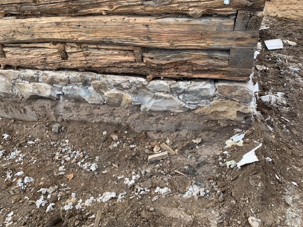 Detail of the log cabin and foundation with the "new" exterior removed. (Courtesy of <a href="https://www.facebook.com/stan.hanson.585">Stan Hanson</a>)