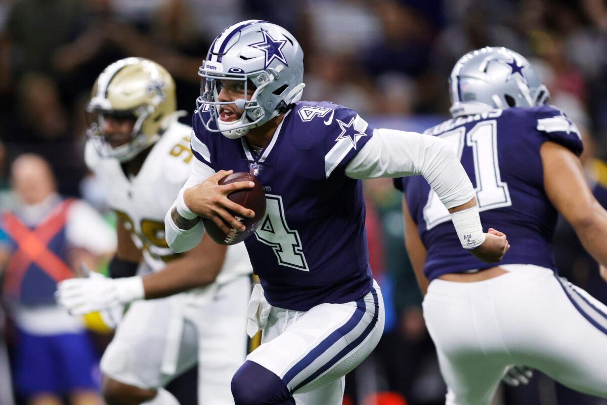 Dallas Cowboys quarterback Dak Prescott (4) runs against the New Orleans Saints during the first half of an NFL football game, in New Orleans on Dec. 2, 2021. (Brett Duke/AP Photo).