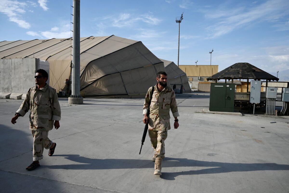 Afghan National Army (ANA) soldiers walk inside the Bagram U.S. air base after all U.S. and NATO troops left, some 43 miles north of Kabul on July 5, 2021. (Wakil Kohsar/AFP via Getty Images)