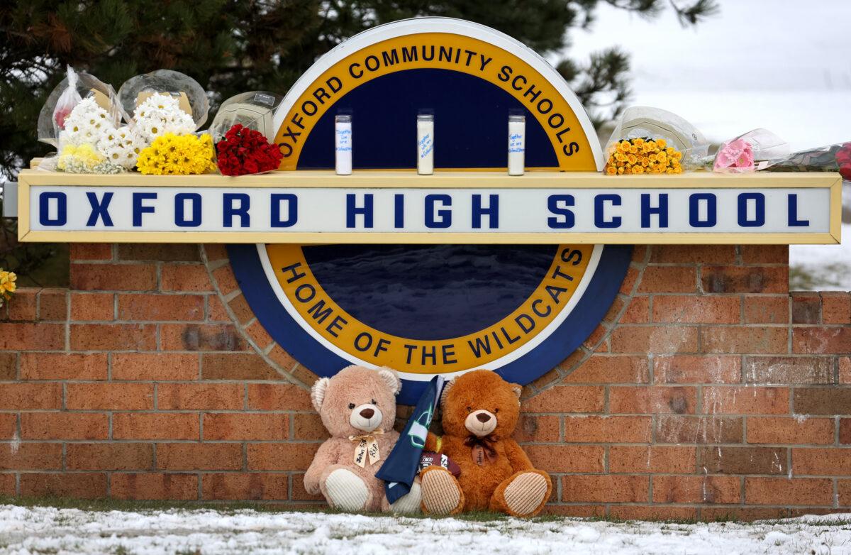 Stuffed bears and flowers are gathered at a makeshift memorial outside of Oxford High School in Oxford, Mich., on Dec. 1, 2021. (Scott Olson/Getty Images)