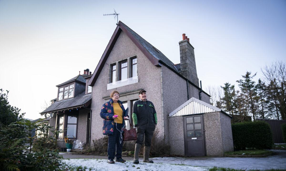 Jim and Belinda Muir, who live at Honeyneuk Farm, Maud, Aberdeenshire, have been without power for over a week on Dec.3, 2021. (Jane Barlow/PA)