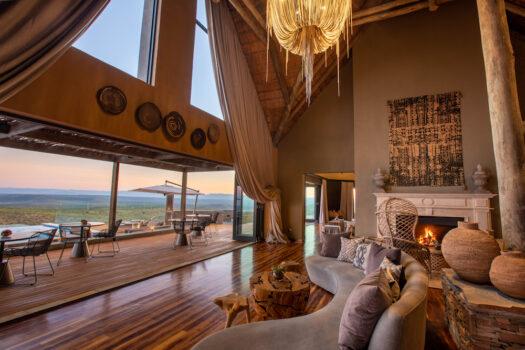 Sky Lodge’s main salon features facing fireplaces and custom furnishings to accentuate the panoramic views of the preserve from inside. Outdoors, the lodge features sweeping decks for sunning in the day and stargazing at night. (Andrew Howard/Magic Hills)