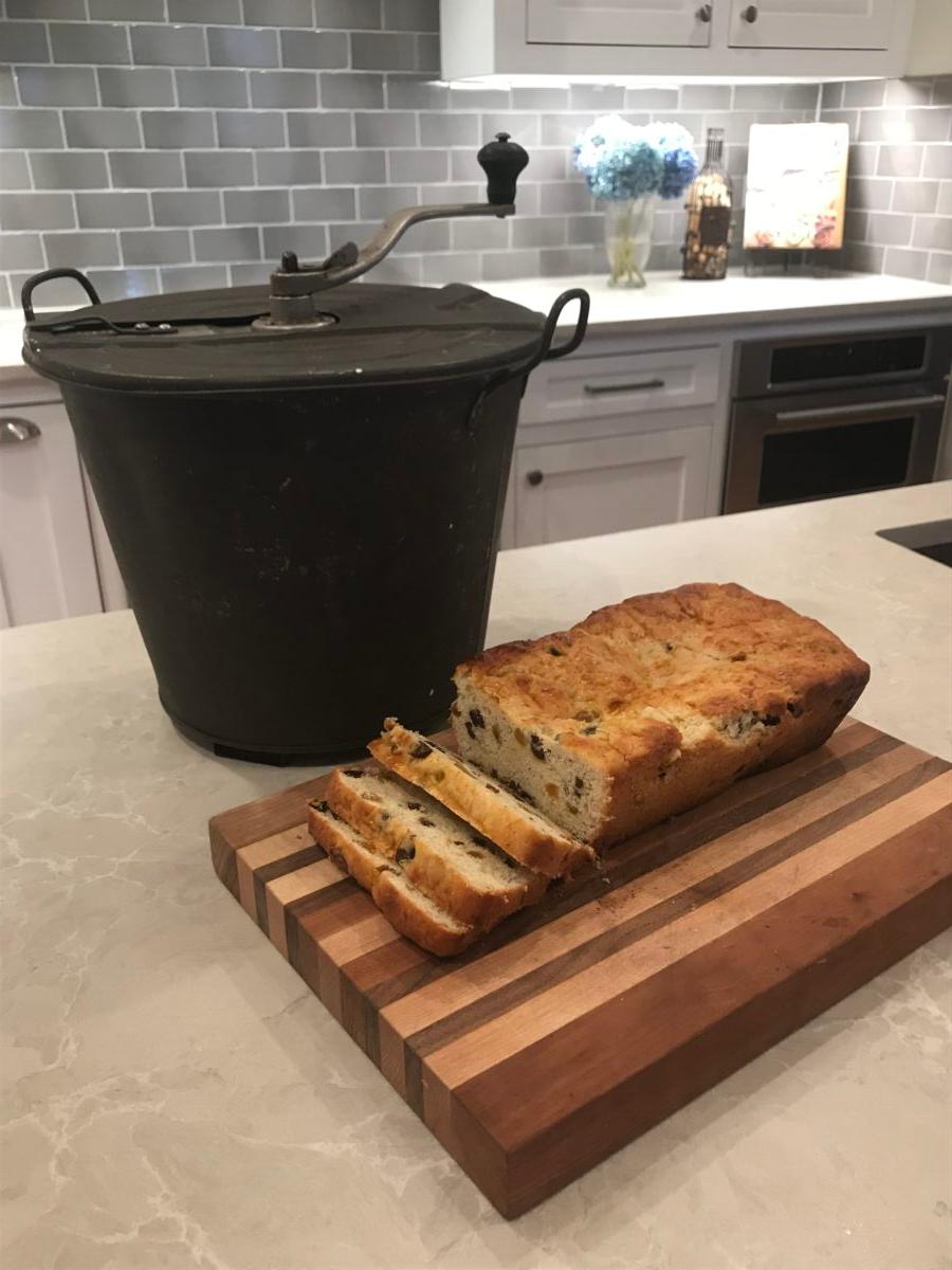 A freshly baked loaf of Siste Kage and the Universal Bread Maker, passed down from the author's great-grandmother Nicoline. (Courtesy of Doris Richardson)