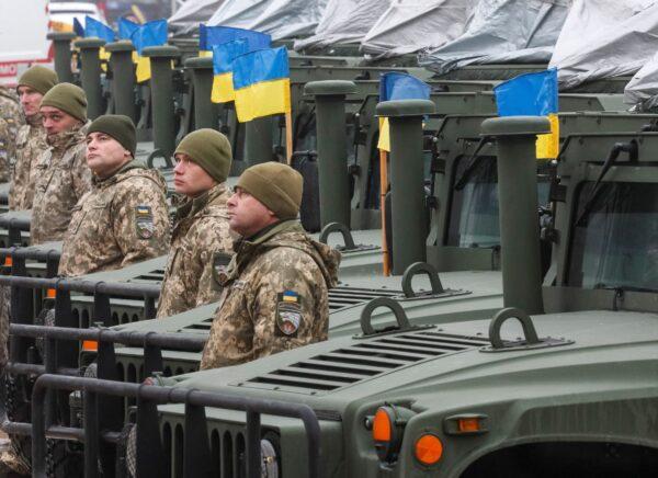 Ukrainian servicemen attend a rehearsal of an official ceremony to hand over tanks, armored personnel carriers, and military vehicles to the Ukrainian Armed Forces as the country celebrates Army Day in Kyiv, Ukraine, on Dec. 6, 2021. (Gleb Garanich/Reuters)