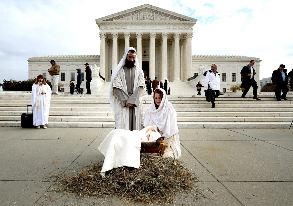 A couple portrays Mary and Joseph during a live nativity scene in front of the U.S. Supreme Court on Dec. 4, 2019. (Mark Wilson/Getty Images)