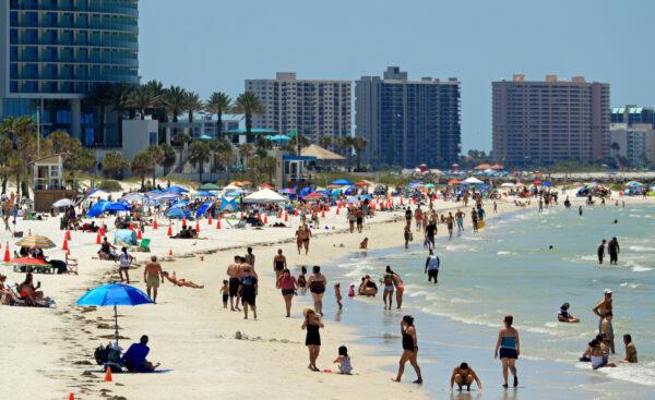 People visit Clearwater Beach on the Gulf Coast of Florida after Gov. Ron DeSantis reopens the state's beaches at 7 a.m. on May 4, 2020. (Mike Ehrmann/Getty Images)