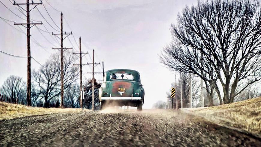 Sunday drive in the winter in rural Douglas County, KS might result being on a dirt road behind a charming hot rod. (Cat Rooney)