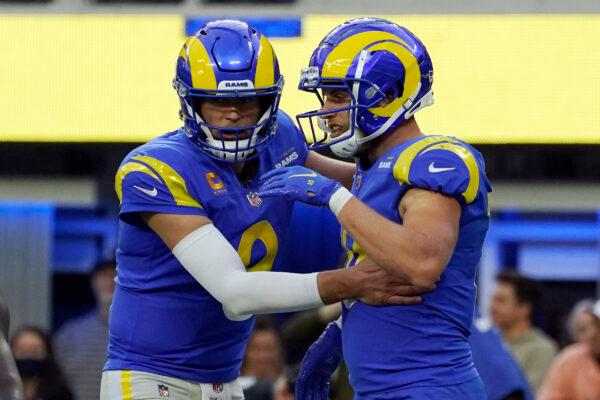 Los Angeles Rams wide receiver Cooper Kupp (R) celebrates his touchdown catch with quarterback Matthew Stafford during the second half of an NFL football game against the Jacksonville Jaguars in Inglewood, Calif., on Dec. 5, 2021. (Mark J. Terrill/AP Photo)