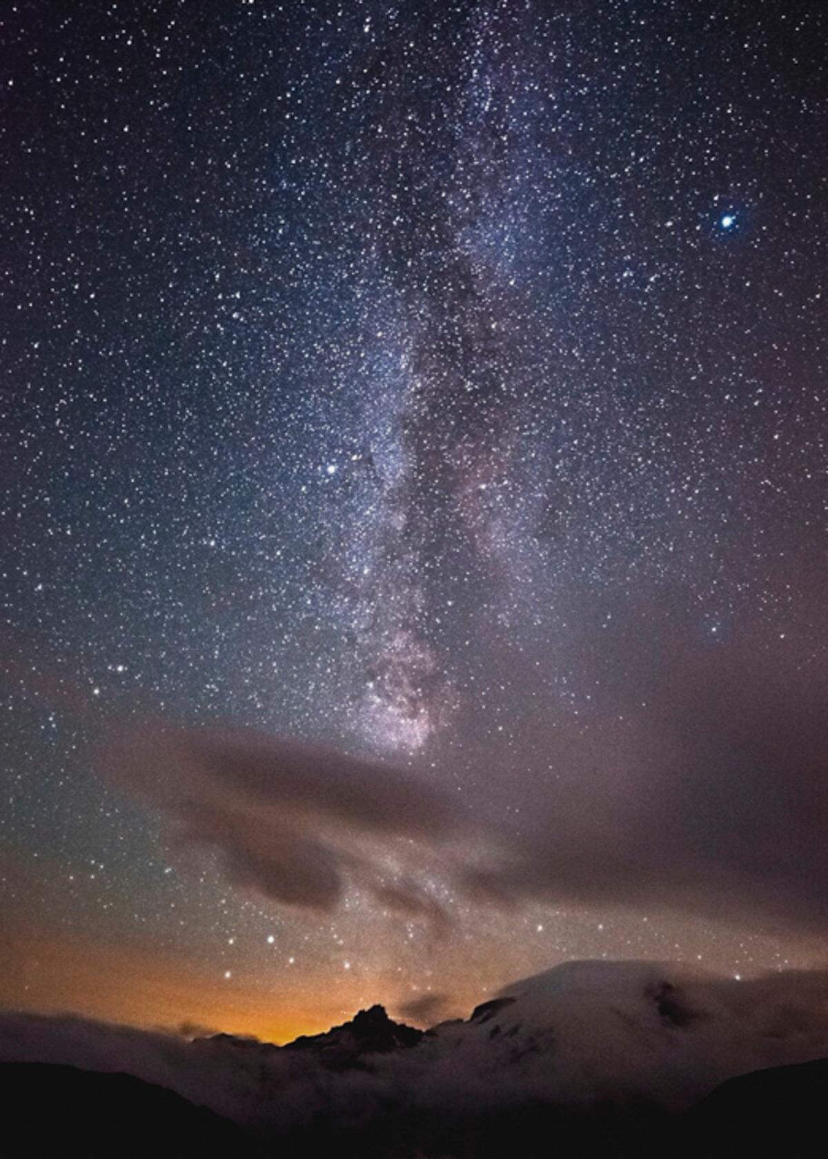 The sight of the Milky Way in a dark sky is breath taking. The camera and digital processing pick-up more stars than what see with the naked eye of the majestic Milky Way above Mt. Rainer, WA. (Cat Rooney)