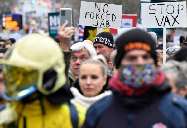 Demonstrators march during a protest against CCP virus measures in Brussels, on Dec. 5, 2021. (Geert Vanden Wijngaert/AP Photo)