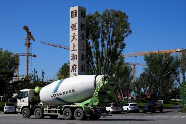 A cement truck moves past a new Evergrande housing development in Beijing, China, on Sept. 22, 2021. (Andy Wong/AP Photo)