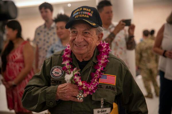 A World War II veteran shows his French Legion of Honor medal during the 80th Anniversary Pearl Harbor Remembrance event in Oahu, Hawaii. (U.S. Navy photo by Mass Communication Specialist 2nd Class Aja Bleu Jackson)