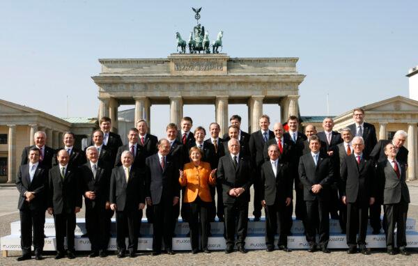 German Chancellor Angela Merkel, center front, gestures while standing with other EU leaders in front of the Brandenburg Gate in Berlin, on March 25, 2007. (Michael Sohn/AP Photo)