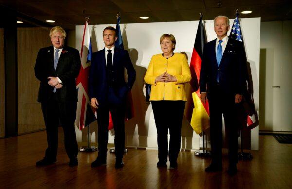 From the right, U.S. President Joe Biden, German Chancellor Angela Merkel, French President Emmanuel Macron and British Prime Minister Boris Johnson pose prior to a meeting on the sidelines of the G20 summit in Rome, on Oct. 30, 2021. (Evan Vucci/AP Photo)