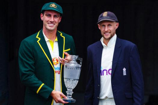 Australia's new captain Patrick Cummins (L) and England's captain Joe Root (R) pose with the Ashes trophy on Dec. 5, 2021, at the Gabba in Brisbane in Australia. (Patrick Hamilton/AFP /AFP via Getty Images)