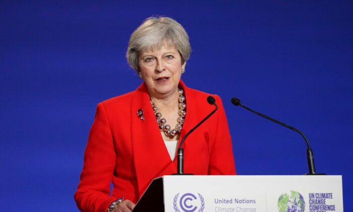 Former British Prime Minister Theresa May Warns of Economic Impact of COVID-19 Curbs