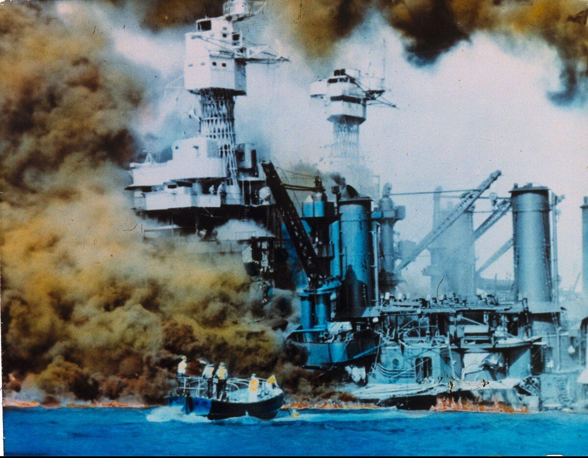 American warships on fire in Pearl Harbor, Oahu Island, after a surprise attack by Japanese forces, which brought the USA into WWII. (Photo by MPI/Getty Images)