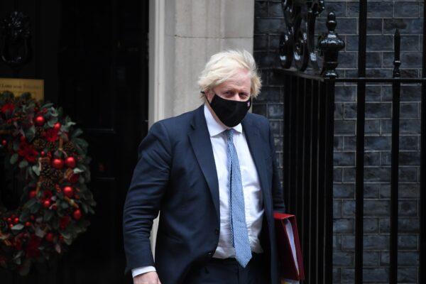 British Prime Minister Boris Johnson leaves Downing Street to attend Prime Minister's Questions in the House of Commons, on Dec. 8, 2021. (Chris J Ratcliffe/Getty Images)