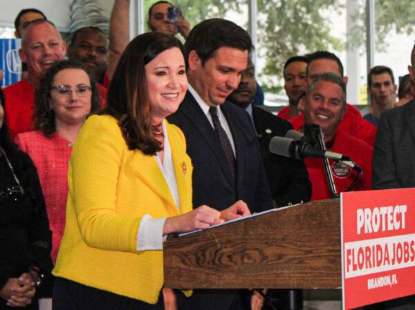 Florida Attorney General Ashley Moody speaks at a press conference in Brandon, Fla., on Nov. 18, 2021, with Gov. Ron DeSantis, before he signed a law banning vaccine mandates in the state.(Jann Falkenstern/The Epoch Times)