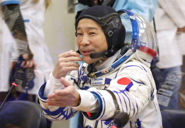Yusaku Maezawa of Japan, member of the main crew of the new Soyuz mission to the International Space Station (ISS), gestures prior the launch at the Russian leased Baikonur cosmodrome, Kazakhstan, on Dec. 8, 2021. (Pavel Kassin/Roscosmos Space Agency via AP)