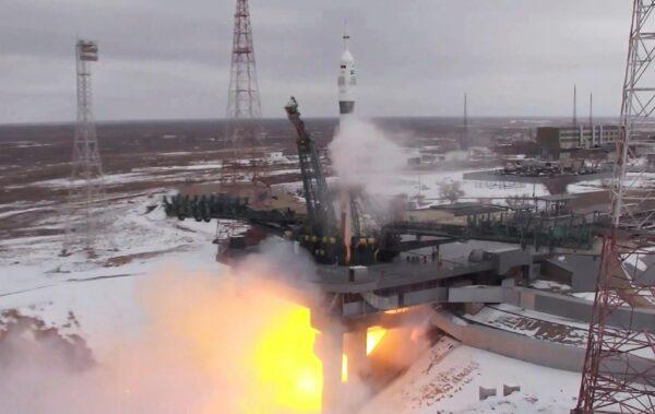 In a still from video released by the Roscosmos Space Agency, the Soyuz-2.1a rocket booster with Soyuz MS-20 space ship carrying Russian cosmonaut Alexander Misurkin, spaceflight participants Yusaku Maezawa and Yozo Hirano of Japan to the International Space Station, ISS, blasts off at the Russian leased Baikonur cosmodrome, Kazakhstan, on Dec. 8, 2021. (Screenshot via NTD/Roscosmos Space Agency via AP)