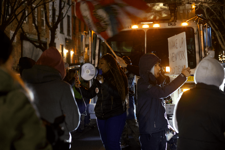 Protesters outside Bill de Blasio's residence in Brooklyn, New York, on Dec. 8, 2021. (Enrico Trigoso/The Epoch Times)