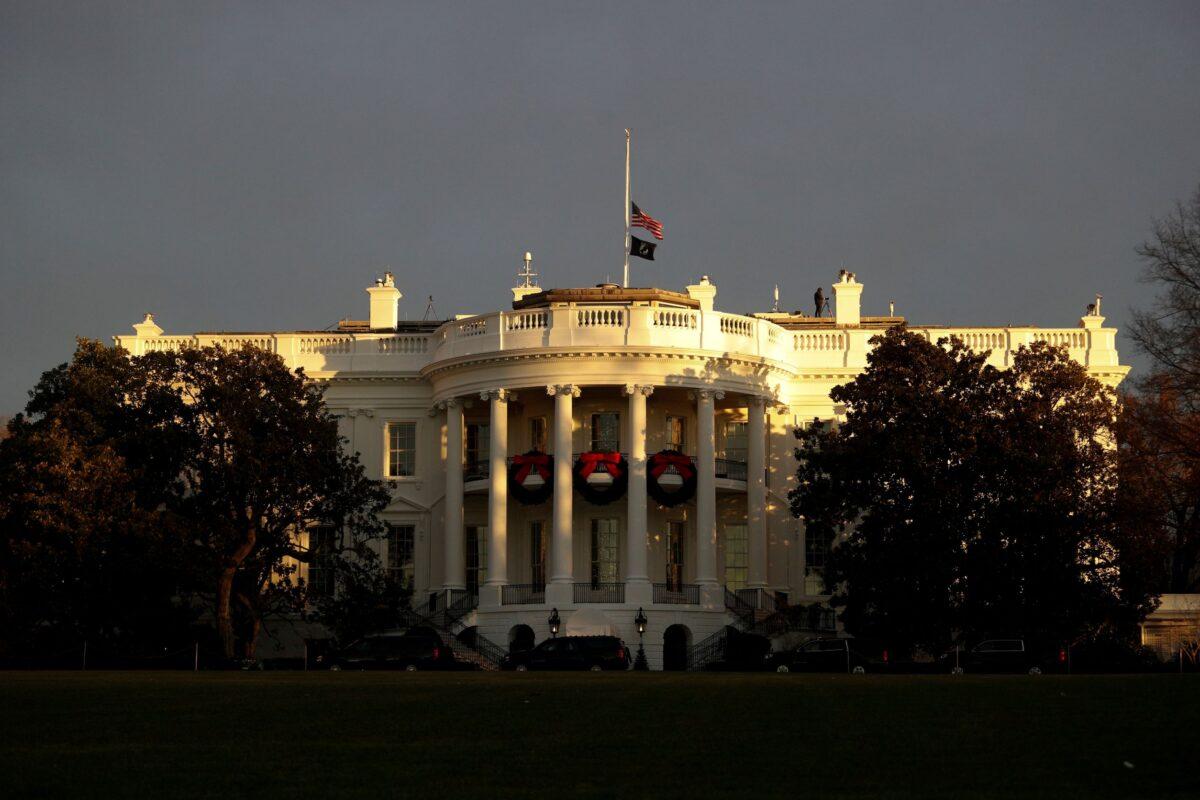 The White House is seen at sunrise, from the South Lawn driveway in Washington on Dec. 7, 2021. (Tom Brenner/Reuters)