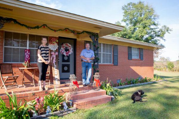 Melissa Whitley and Jesse "Buz" Whitley on their porch in Bainbridge, Ga., on Nov. 10, 2021. (Amanda Greene for The Epoch Times)