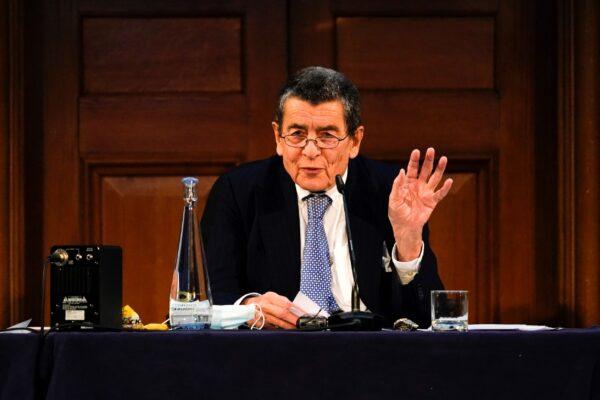 Tribunal chair Geoffrey Nice delivers the verdict of the independent tribunal assessing evidence of China’s alleged rights abuses of the Uyghur people. The tribunal took place in London on Dec. 9, 2021. (Alberto Pezzali/AP Photo)