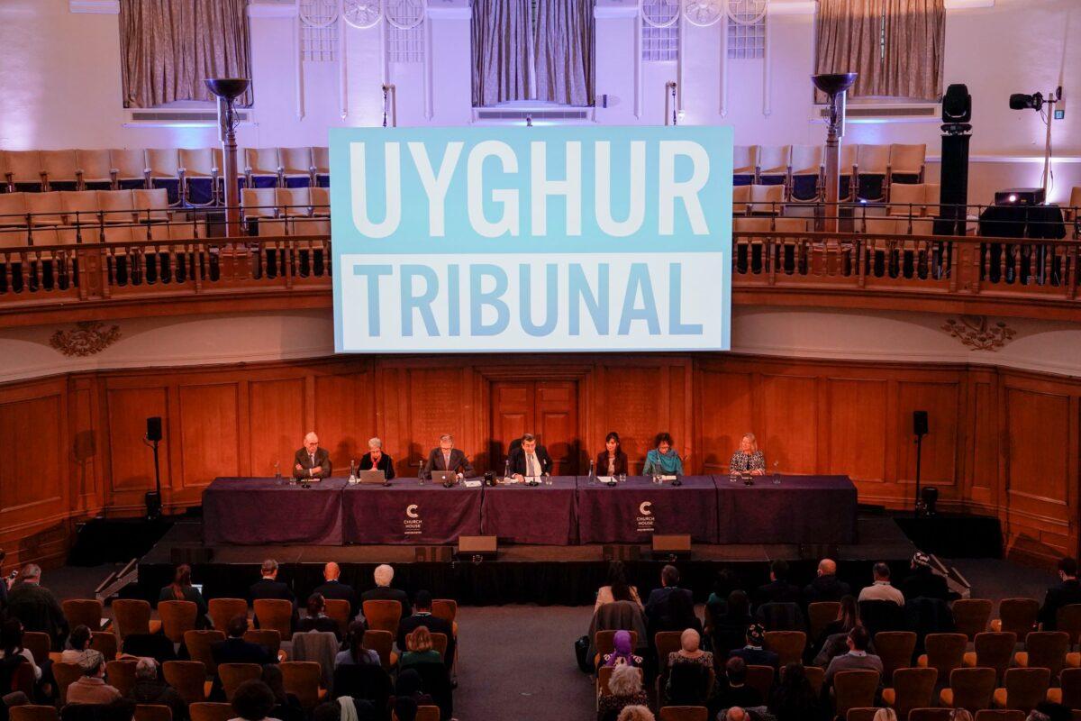Tribunal chair Geoffrey Nice (C) delivers the verdict of the independent tribunal assessing evidence on China’s alleged rights abuses against the Uyghur people, in London, on Dec. 9, 2021. (Alberto Pezzali/AP Photo)