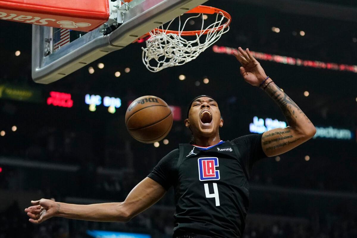 Los Angeles Clippers guard Brandon Boston Jr. (4) reacts after dunking the ball during the first half of an NBA basketball game against the Boston Celtics in Los Angeles, on Dec. 8, 2021. (Ashley Landis/AP Photo)