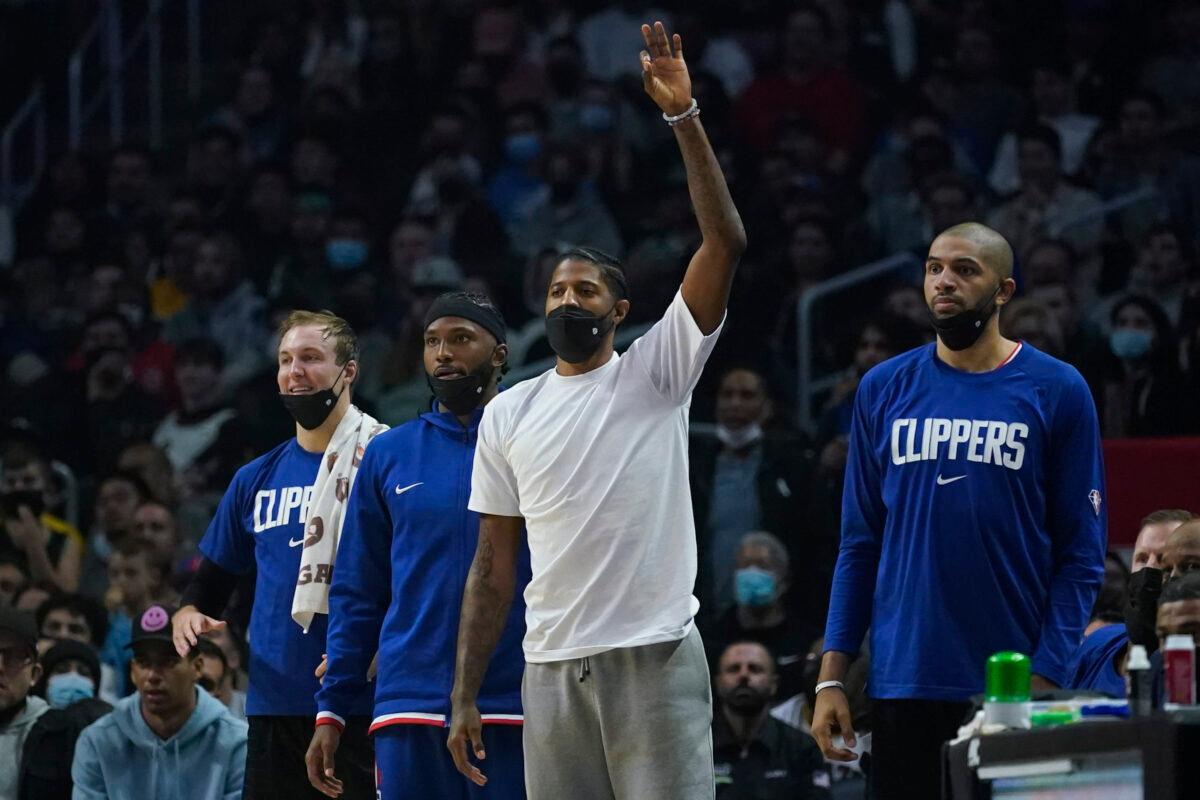 Los Angeles Clippers' Paul George, center, celebrates after a 3-pointer during the first half of an NBA basketball game against the Boston Celtics in Los Angeles, on Dec. 8, 2021. (Ashley Landis/AP Photo)