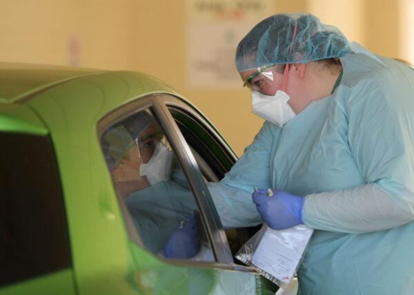 Health staff conduct tests at the COVID-19 testing centre in the Reactivating the Repat Hospital in Adelaide, Australia, on March 11, 2020. (Tracey Nearmy/Getty Images)